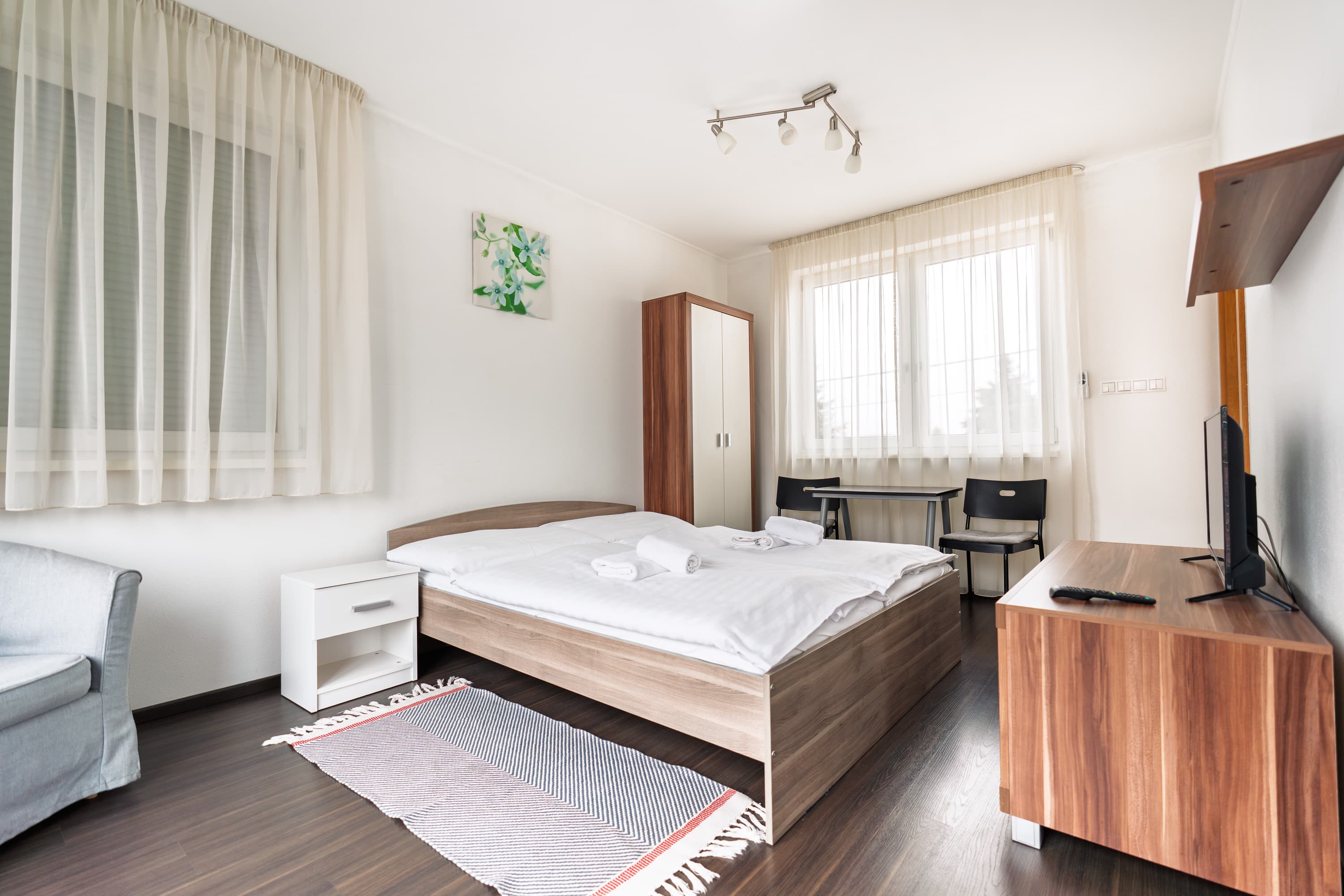 Obývacia izba s kuchynkou v apartmáne Fine