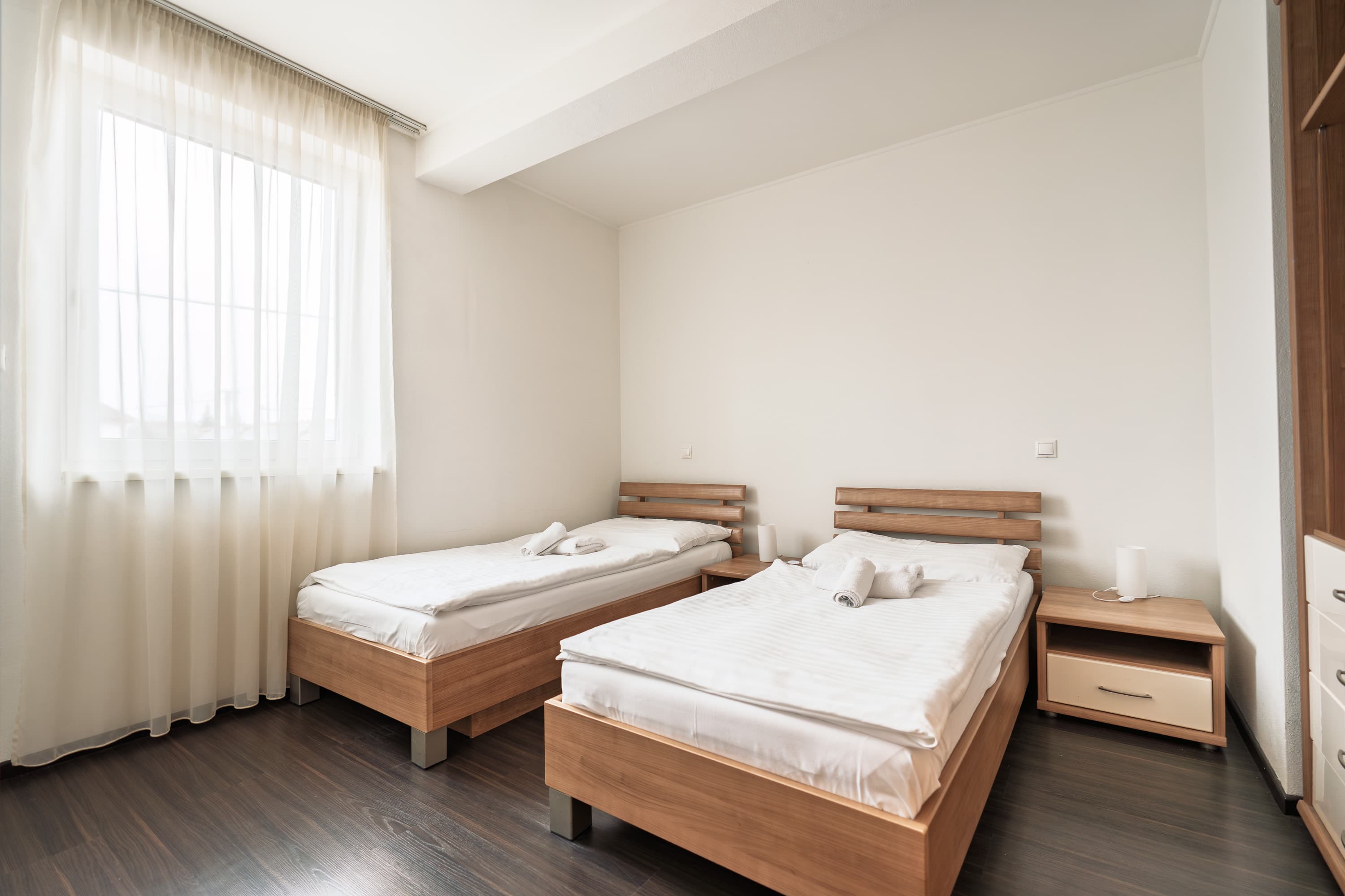 Spálňa s dvoma lôžkami v apartmáne Fine